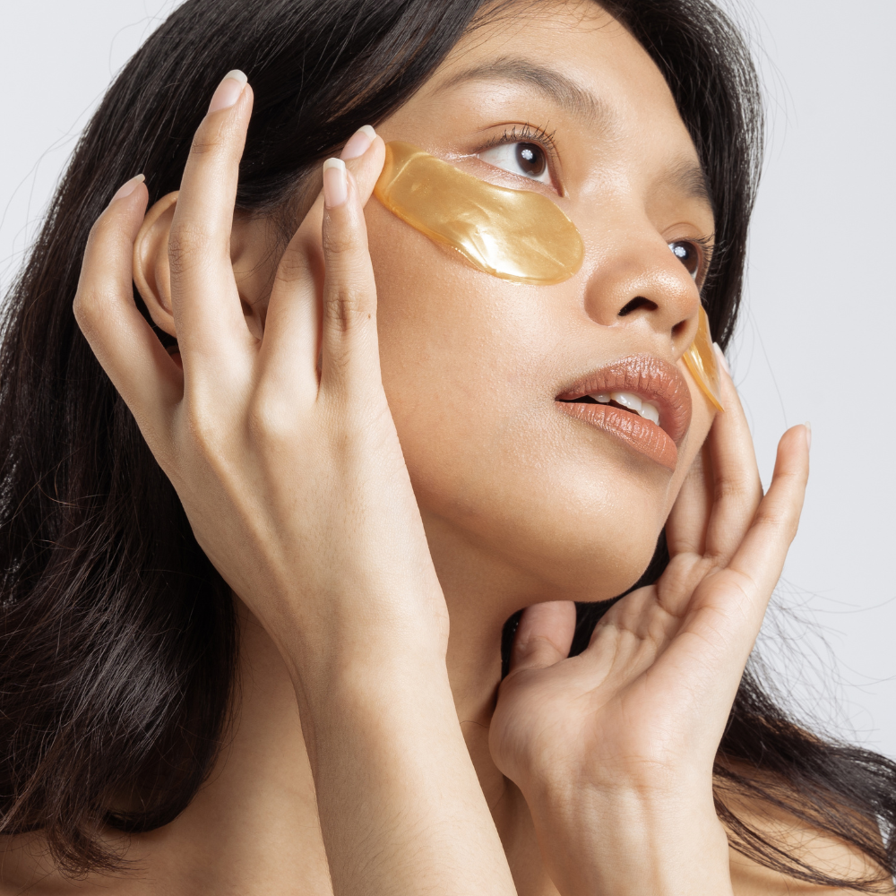 Close up photo of a woman using Femvy Gold Collagen Eye Mask  3