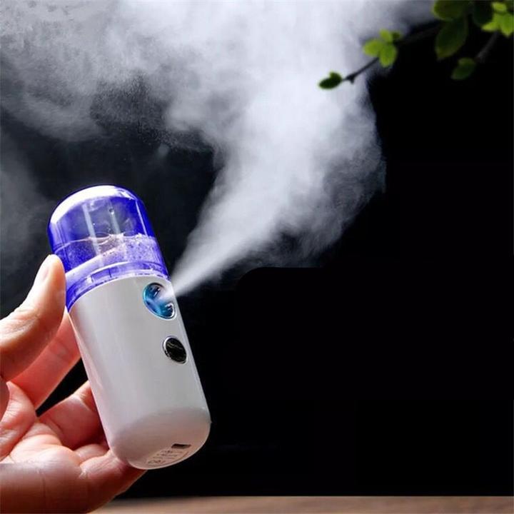 Image of hand holding Portable Travel Sized Facial Mist Spray Atomiser