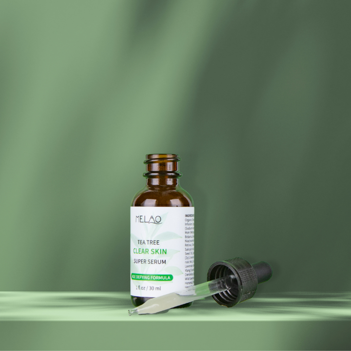 tea tree clear skin super serum 30ml with an open bottle